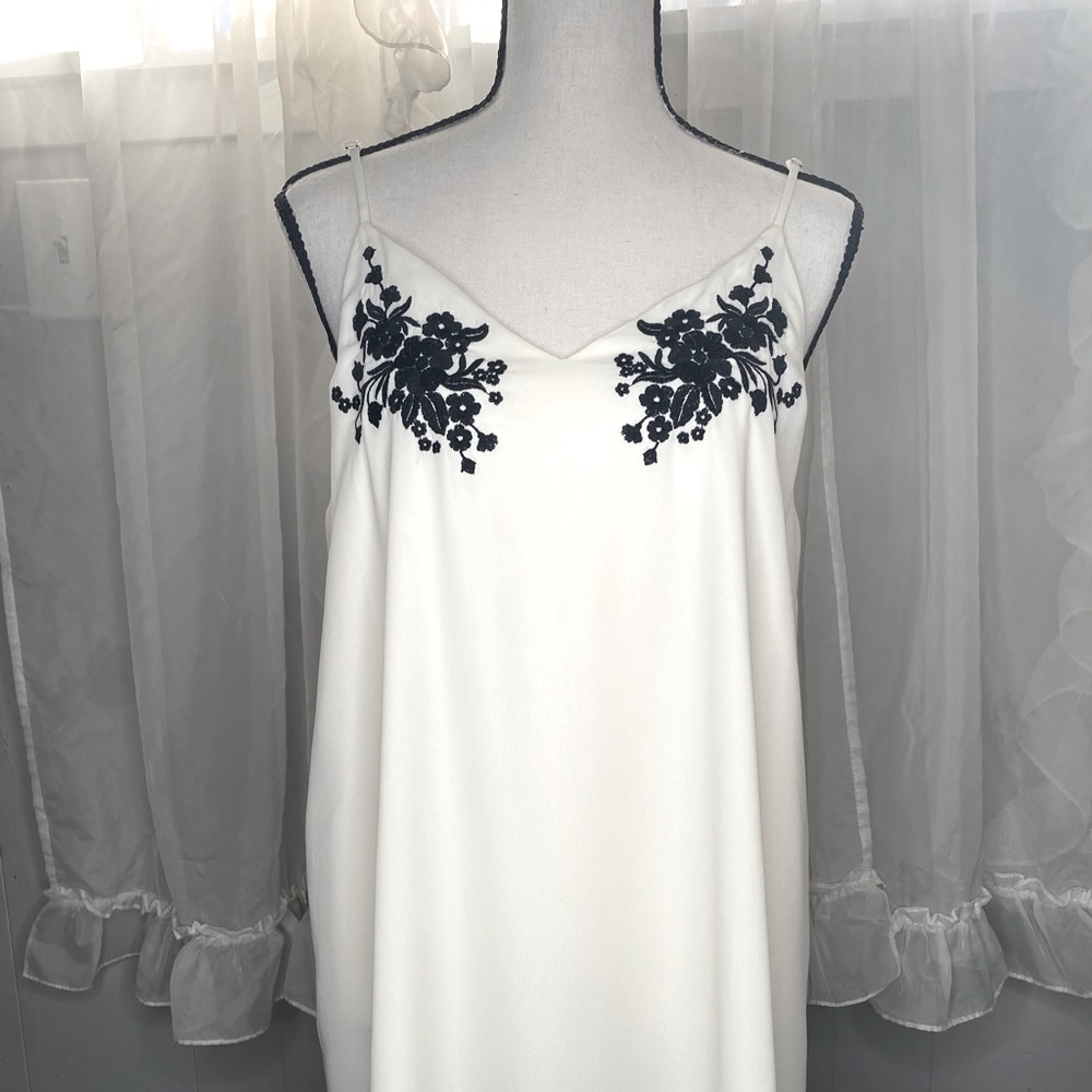 Bone white slip dress with black floral embroidery